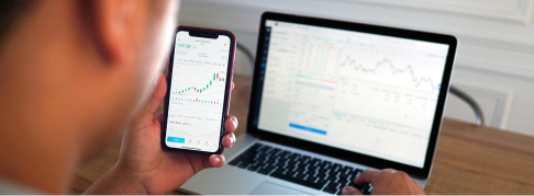 Phone and laptop tracking stock graphs