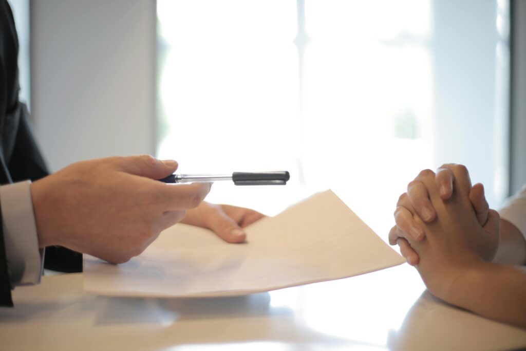 Hands across a table in a meeting