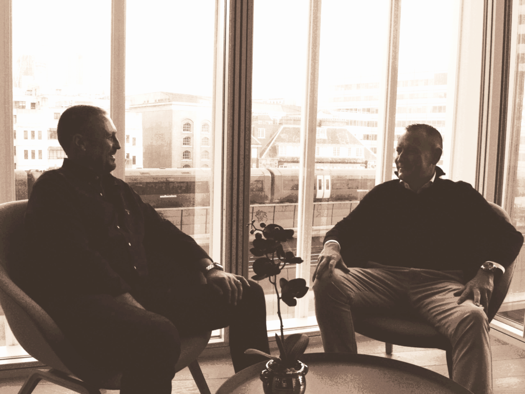 Kenny And Scott sitting at a table in their London office