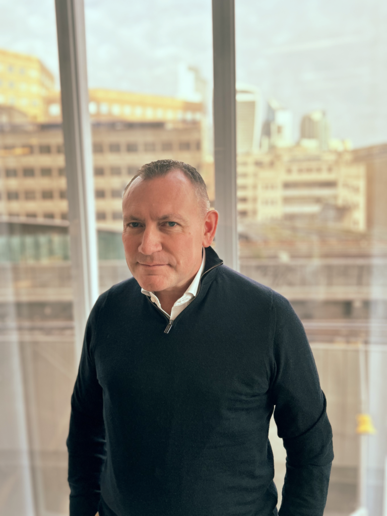 Scott Taylor standing in Inicio's sunny London office